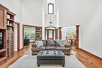 Continue to the great room with soaring ceiling.