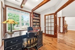 Built in bookshelves and wood beam ceiling.