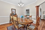 Crown moulding and chandelier lighting.