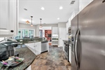 Stainless steel appliances and built in desk.