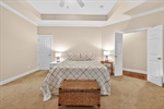Spacious with tray ceiling and lighted fan.