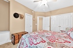 Lighted fan and double closet.