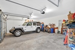 Oversized side entry 2 car garage with openers.