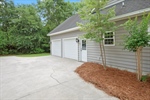 Extra parking pad and side entry garage.