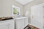 Laundry room with utility sink.