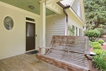 Front Porch Swing and Door to Laundry Room