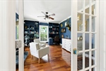 To your left through French doors is the office.