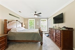 Ascend the stairs to the bedroom level.