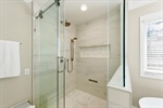 Separate walk in tiled shower.