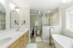 Double raised vanities with quartz counters.