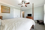 Lighted fan and double closet.