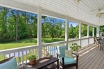 Large deck overlooking the private back yard.
