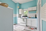 Continue to the charming kitchen.