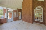 Screened back porch with vaulted ceiling.
