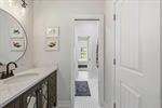 Separate vanity. Renovated bath with pocket doors.