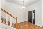 Entry foyer with refinished hardwoods