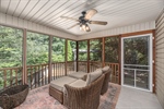 Three-season porch with glass panel inserts