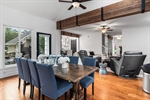 The living room unfolds to the dining room.