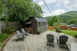 Stamped concrete patio and shed with electricity