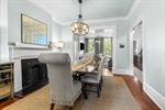 The living room flows into the formal dining room.