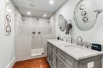 Walk in tiled shower.