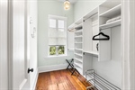 Wonderful walk in closet with built ins.