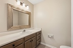 Bathroom with large vanity for storage.