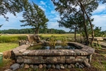 Complete with ornamental pond with waterfall.