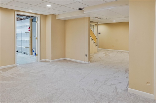 Recreation room opens to laundry room