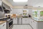 Gorgeous kitchen with tile flooring.