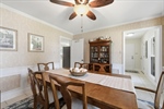 Crown moulding and lighted fan.