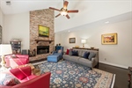 Cozy floor to ceiling gas log fireplace.