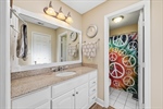 Ensuite bath with tile flooring. Shower over tub.