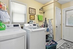 Laundry room with screened porch access.
