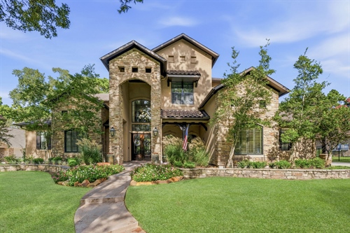 Stucco and stone exterior 3 car garage