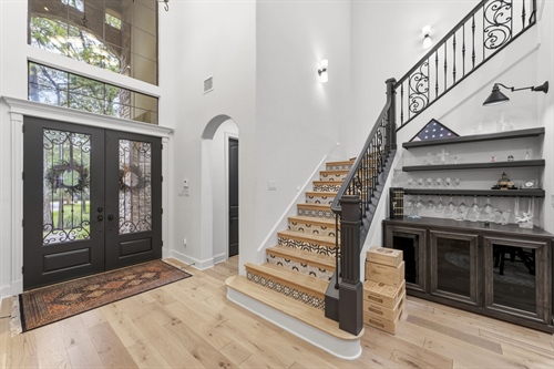 Impressive spacious foyer with arched entries
