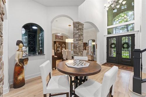 Soaring ceilings and arched entries throughout