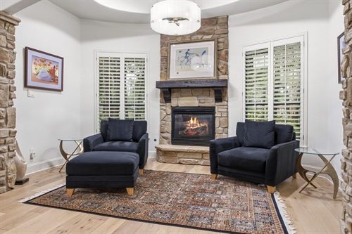Cozy sitting space with gas log fireplace