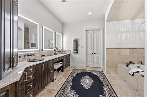 Dual vanities with 3 LED mirrors with Apple TV