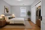 Unit 1 main bedroom virtually staged