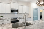 Large flat bar island with under mount sink.