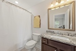 Ensuite second full bath with shower over tub.