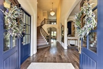 Double doors open to expansive foyer