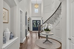 Curving staircase with wod paneling