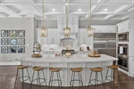 Large curved island is focus of the kitchen