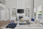 Built-ins flank the gas log fireplace