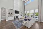 Family room has floor to ceiling fireplace