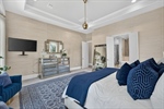Plush carpet oversize baseboards crown molding