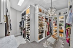 Boutique-style walk-in primary closet
