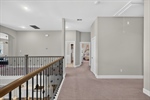 Upper hallway provides views to family room